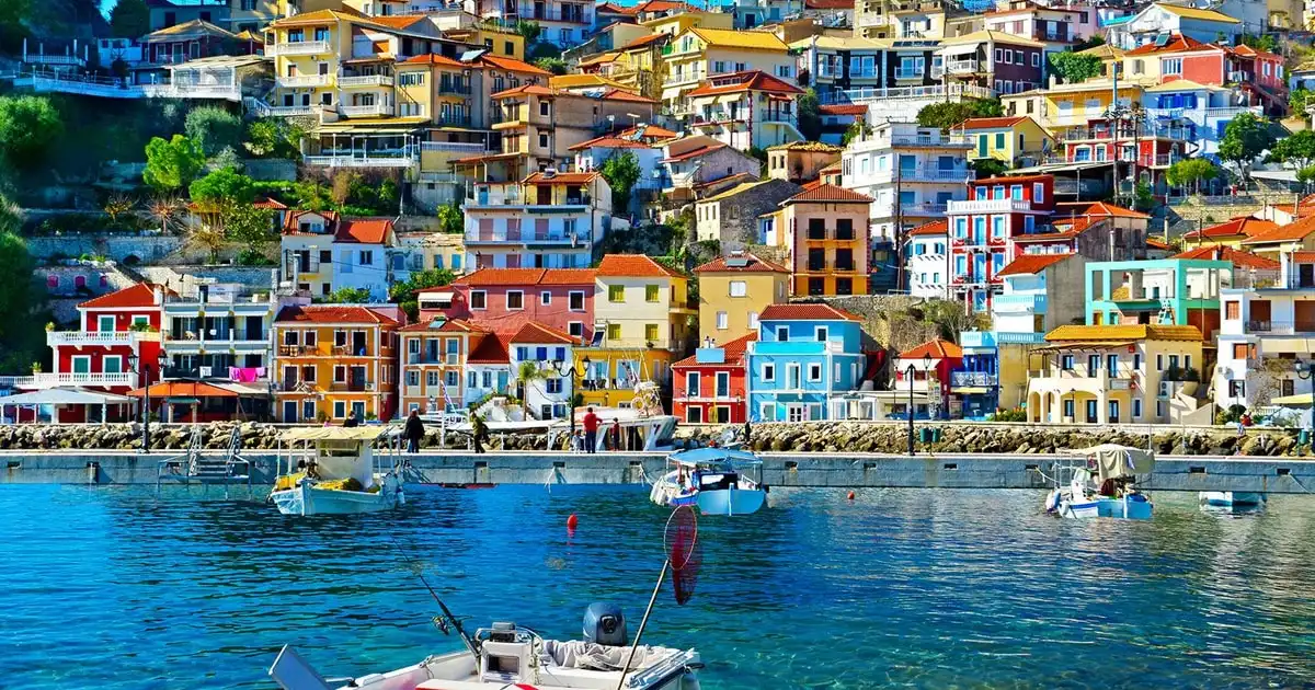 Colourful houses of Parga above the harbour seen from a cruise boat on a Corfu boat tour to Parga and Sivota